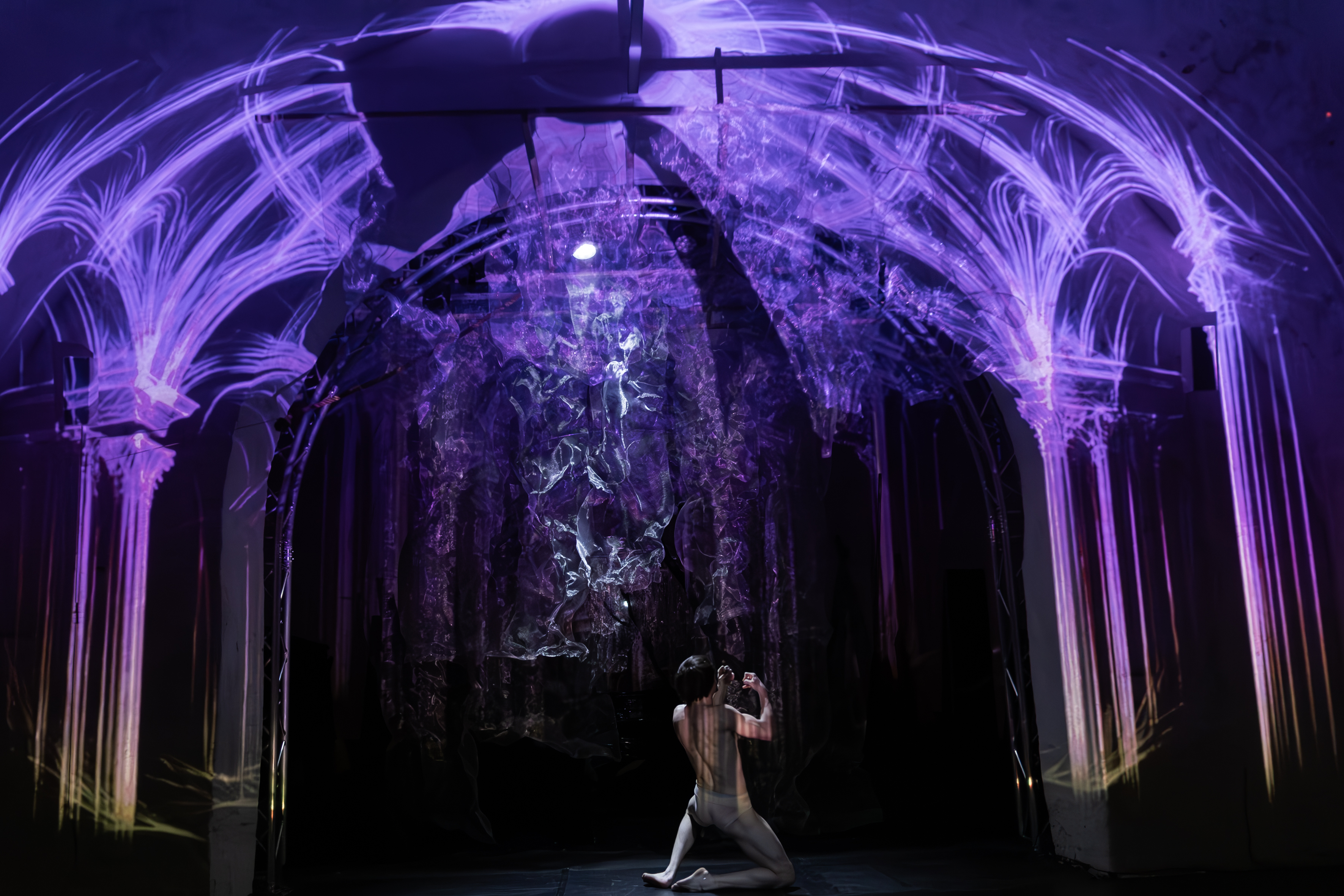 Projected architecture and solo performer in BROKE'N; an odd Messiah