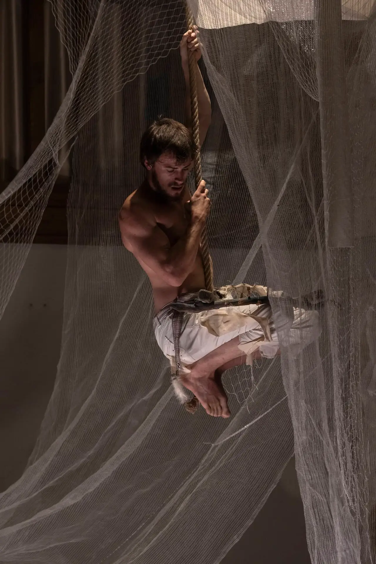 Nico Dorigatti climbing a rope in BROKE'N, photographed by Saygin Mavinil